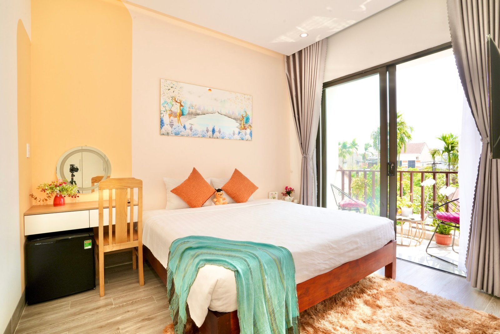 King-size bed in Sunny Balcony King Room, bright balcony room in Hoi An