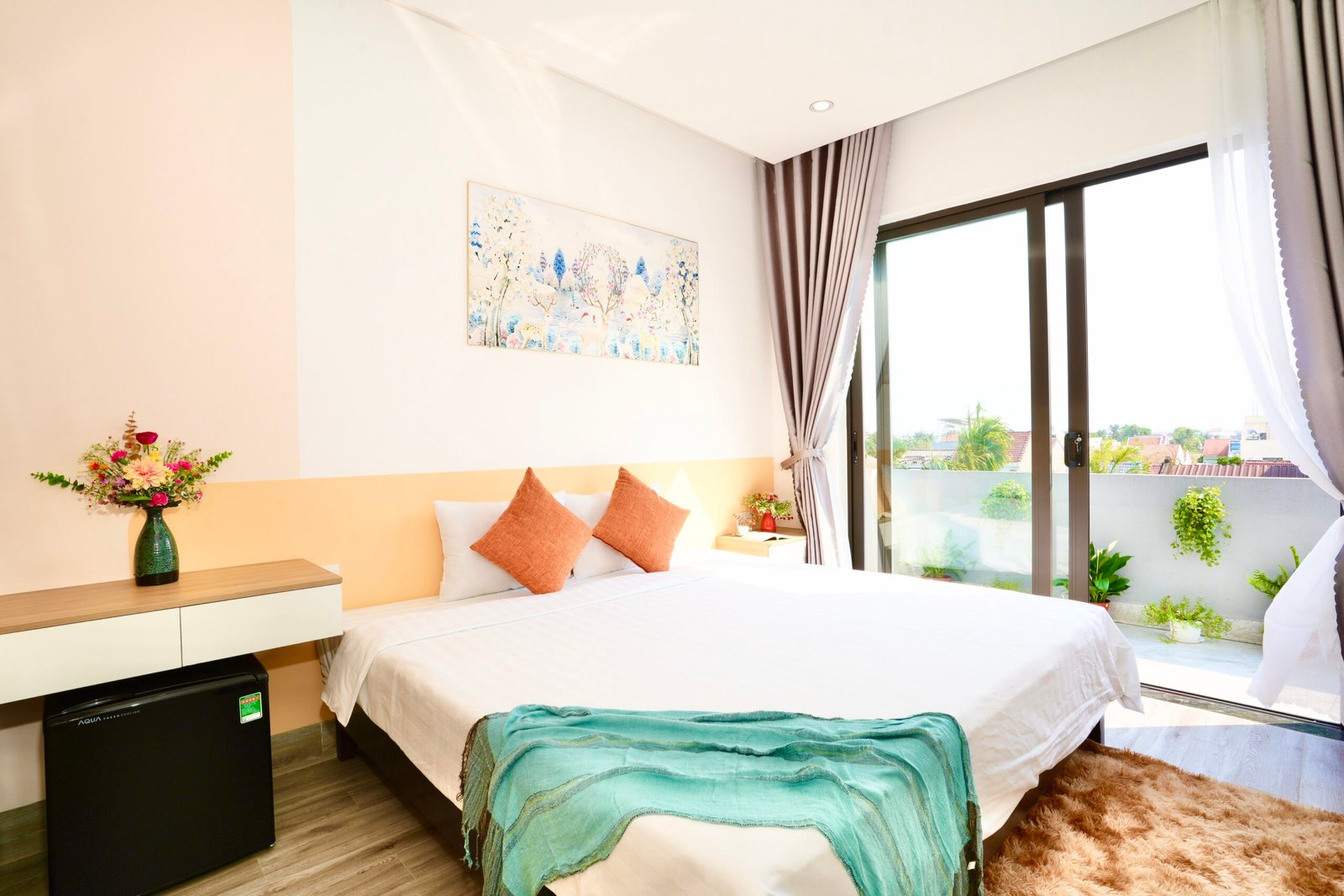 King-size bed in top-floor Private Dual Balcony King Room, quiet long-stay room in Hoi An